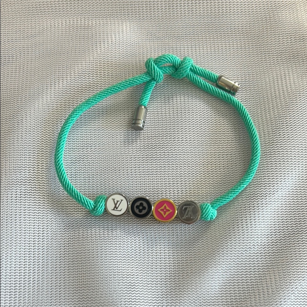 Teal rope bracelet with multi colored beads